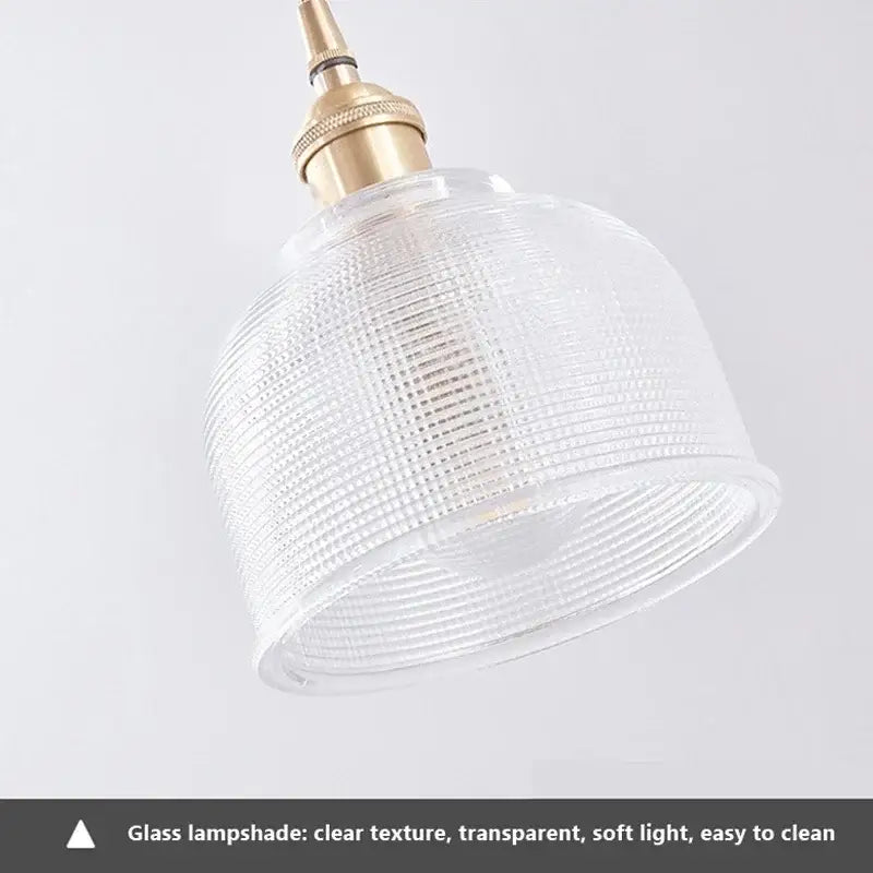 Vintage brown and polished chrome glass pendant light with clear textured glass lampshade and brass fixture for dining room
