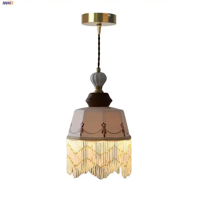Vintage brown wood ceramic pendant lights featuring a beige glass shade with brown patterns and golden beaded fringe decorbites brown wood