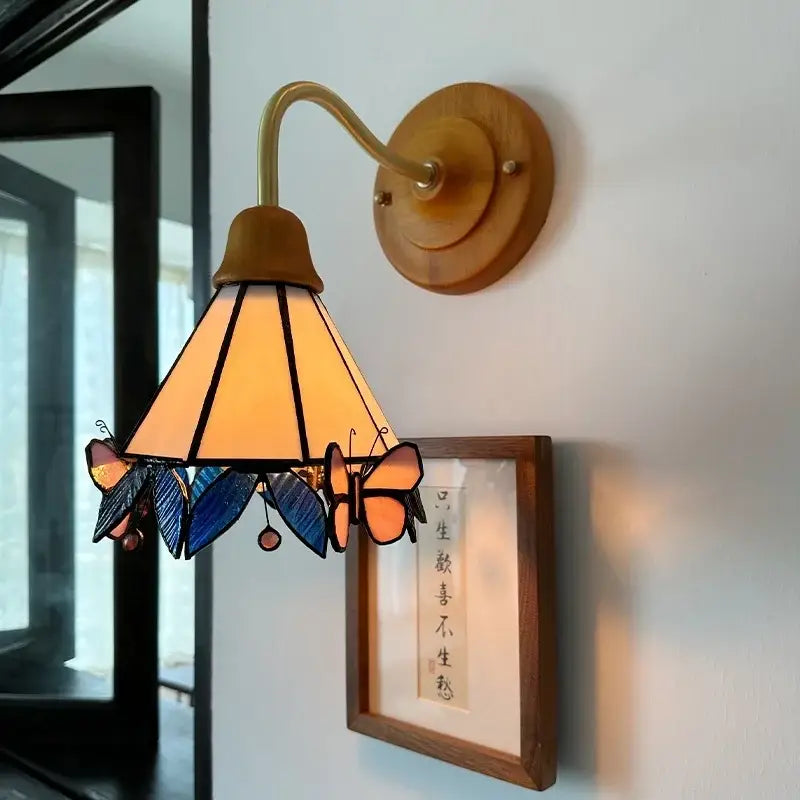 Vintage butterfly glass wall light with copper arm amber conical shade and wooden base by decorbites butterfly glass