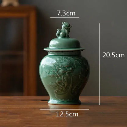 Vintage celadon green ceramic tea caddy with dragon relief and lion figurine lid for kitchen storage jar use