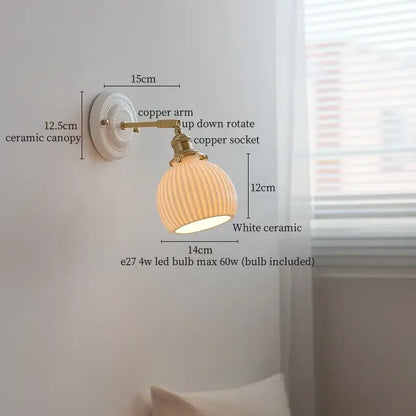 White ceramic and brass wall sconce light with ribbed glass shade and pull chain for vintage bedroom decor