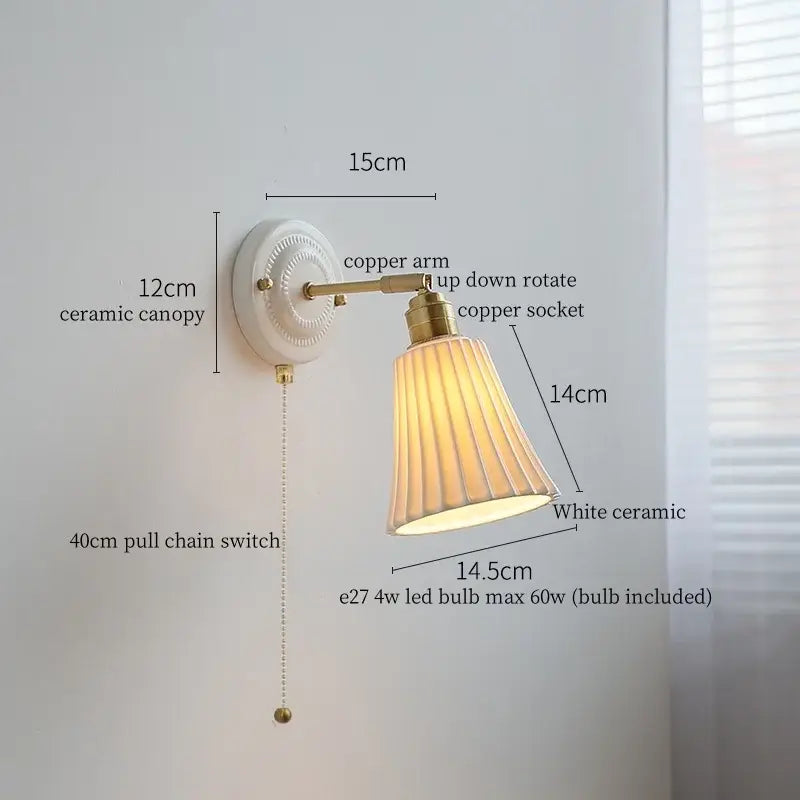 Vintage white ceramic and brass wall sconce light with fluted shade and copper arm for bedroom with pull chain