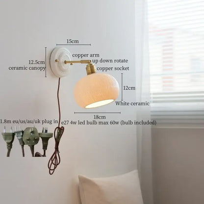 Vintage white ceramic and brass wall sconce light with copper arm and adjustable design for bedroom use with pull chain