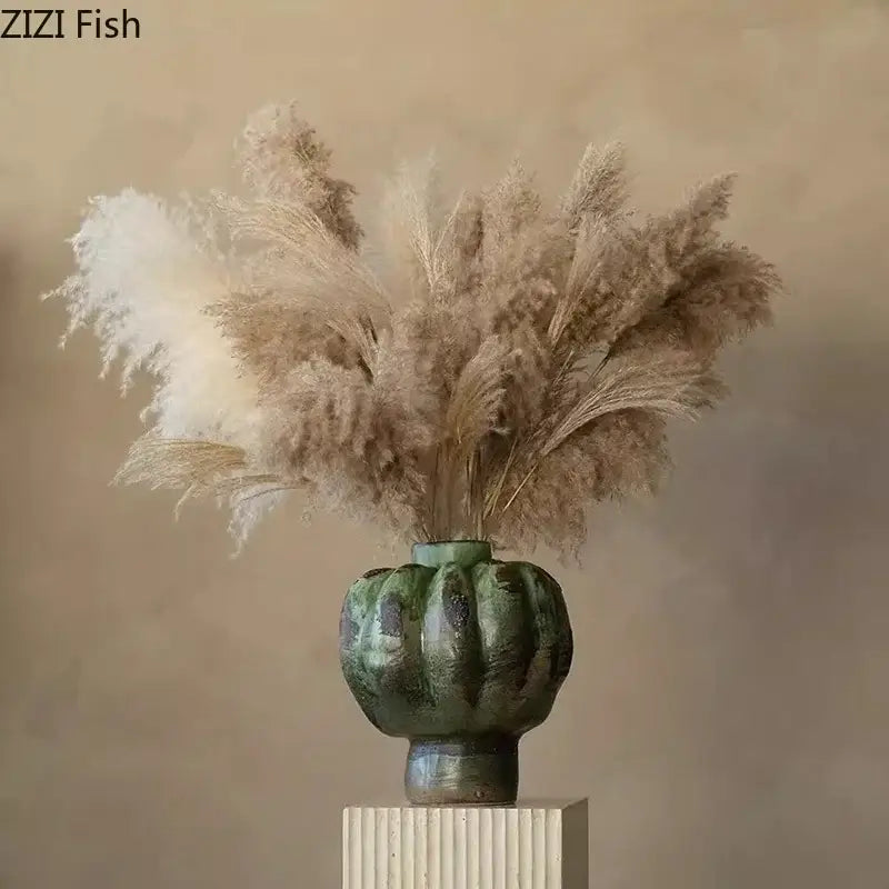 Vintage ceramic vase in moss green with ribbed design holding dried pampas grass for living room decorbites green vintage style