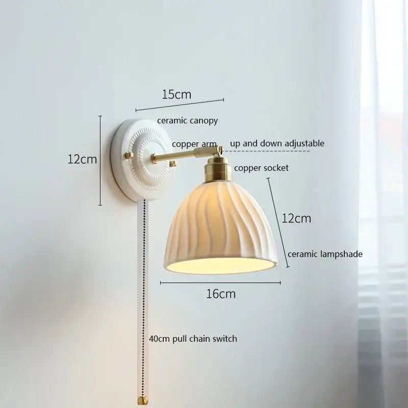 Cream-colored decorbites ceramic wall lamp with fluted glass shade and brass-finished copper arm for bedroom decor