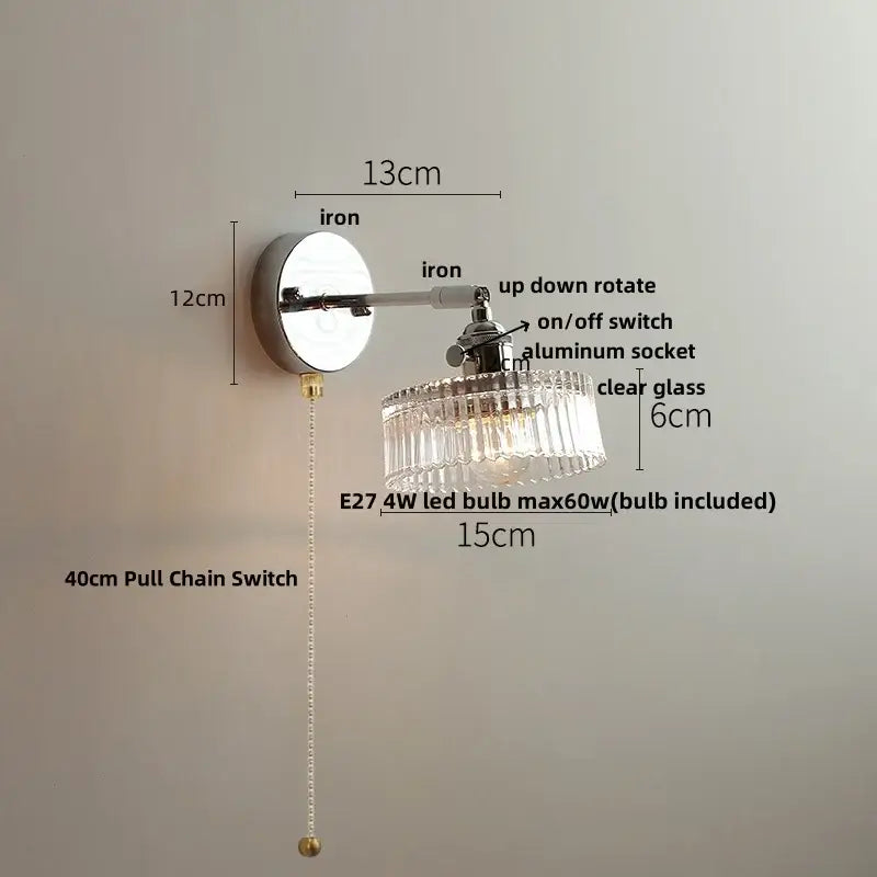 A vintage chrome clear glass wall sconce with a chandelier-style shade and adjustable arm for bedroom lighting decorbites clear glass