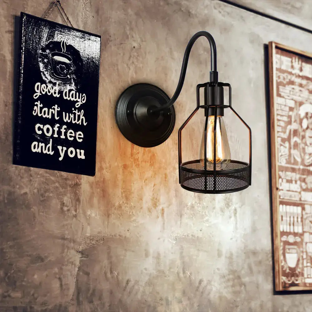 Black wrought iron wall sconce with vintage copper decorbites iron cage and iron cage guard housing exposed edison bulb