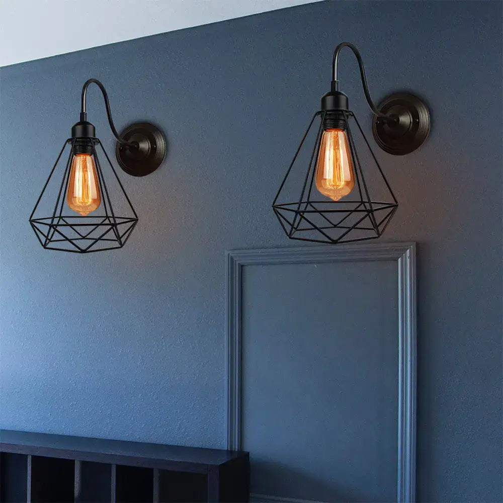 Vintage copper decorbites iron cage wall sconce with black wrought iron cage guard and warm edison bulbs for bedroom lighting