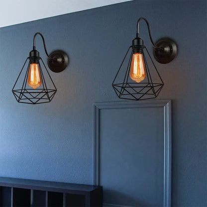 Vintage copper decorbites iron cage wall sconce with black wrought iron cage guard and warm edison bulbs for bedroom lighting