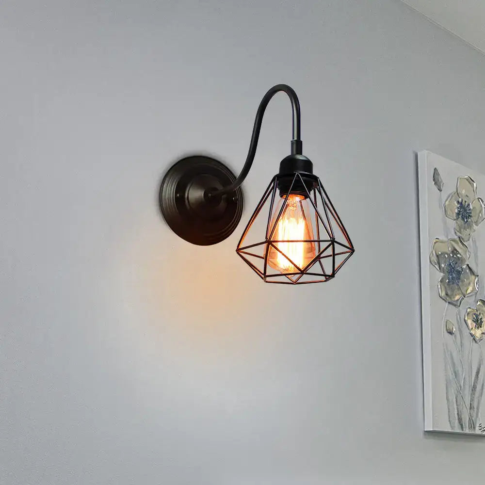 Vintage copper decorbites iron cage wall sconce with black wrought iron cage guard and exposed filament bulb for bedroom light