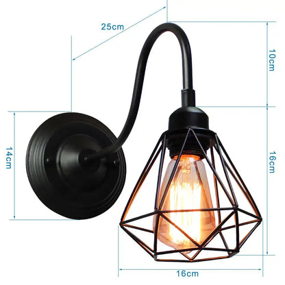 Black wrought iron wall sconce with decorbites iron cage guard and exposed filament bulb for vintage bedroom lighting