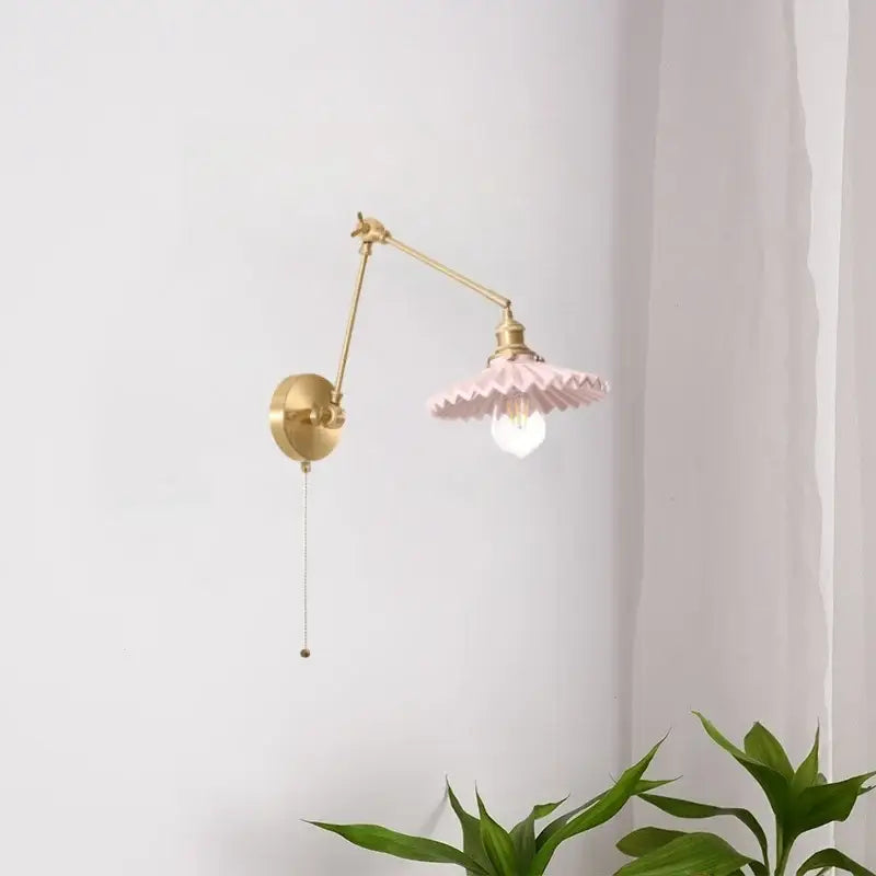 Vintage copper wall sconce with a delicate pink ceramic ruffled lampshade and adjustable brass arm with pull chain decorbites copper vintage