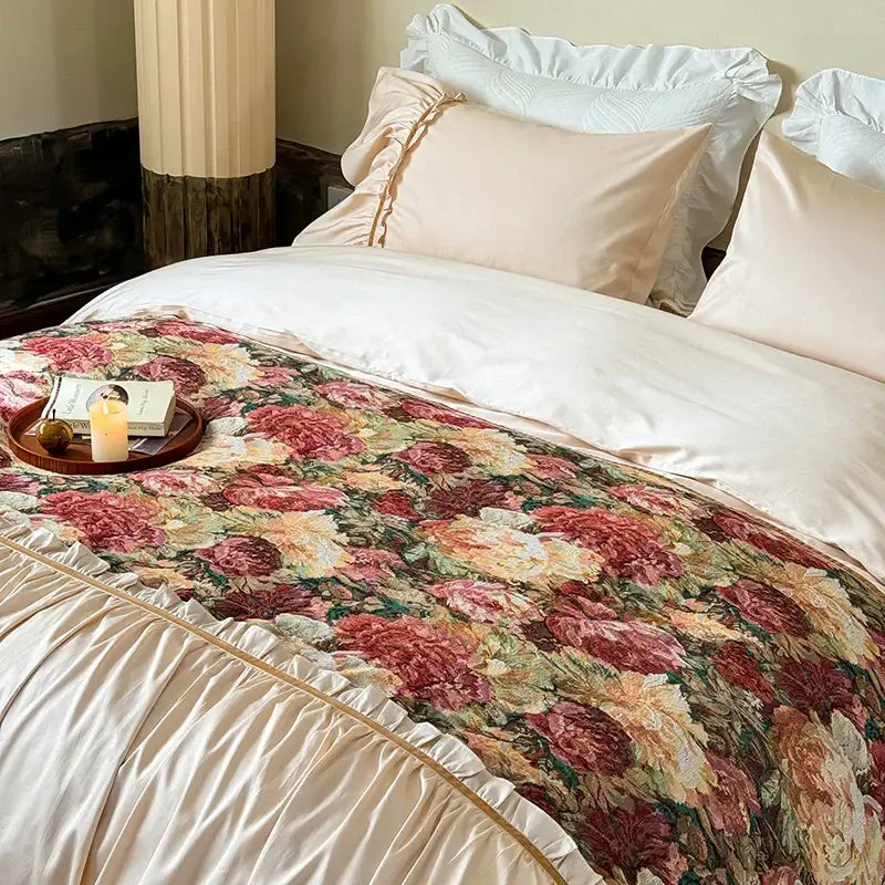 Vintage cream and gold 100s cotton bedding set with floral-patterned bed runner and ruffled edges on dark green background
