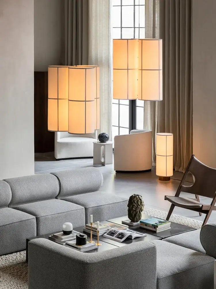 Modern beige cylindrical floor lamps with segmented glowing shades complement vintage cream fabric decorbites hashira cluster pendant light for dining room decor
