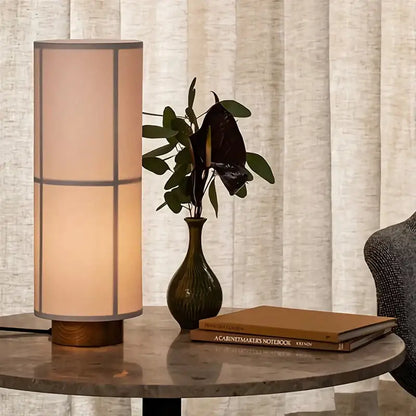 Vintage cream fabric hashira cluster pendant light featuring a warm-toned cylindrical table lamp with wooden base decorbites hashira cluster