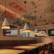 White conical pendant light with warm orange rims from decorbites mélodie vintage dark blue light blue cement fixture