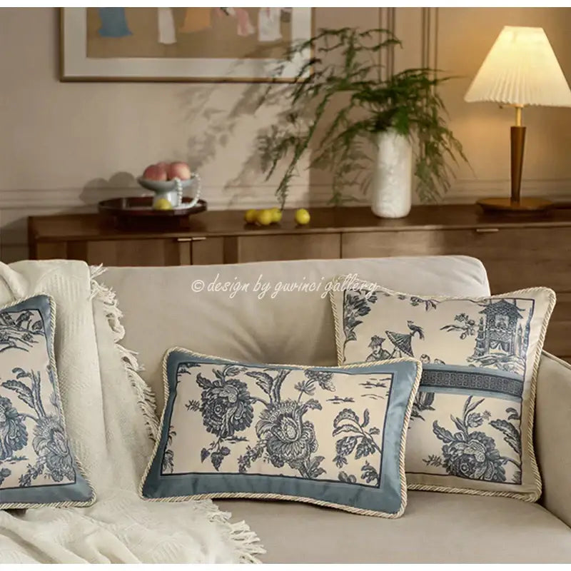 Blue and cream floral patterned vintage delft blue toile cushion covers with fringed edges and rope trim decor