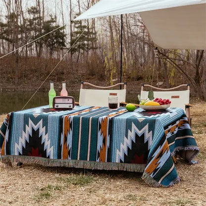 Teal white and orange geometric patterned woven vintage earth tone bohemian cotton plaid sofa blanket with fringed edges