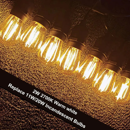 Warm white 2w vintage-style edison filament bulbs with clear glass and black metal caps for decorbites amber plastic patio string light