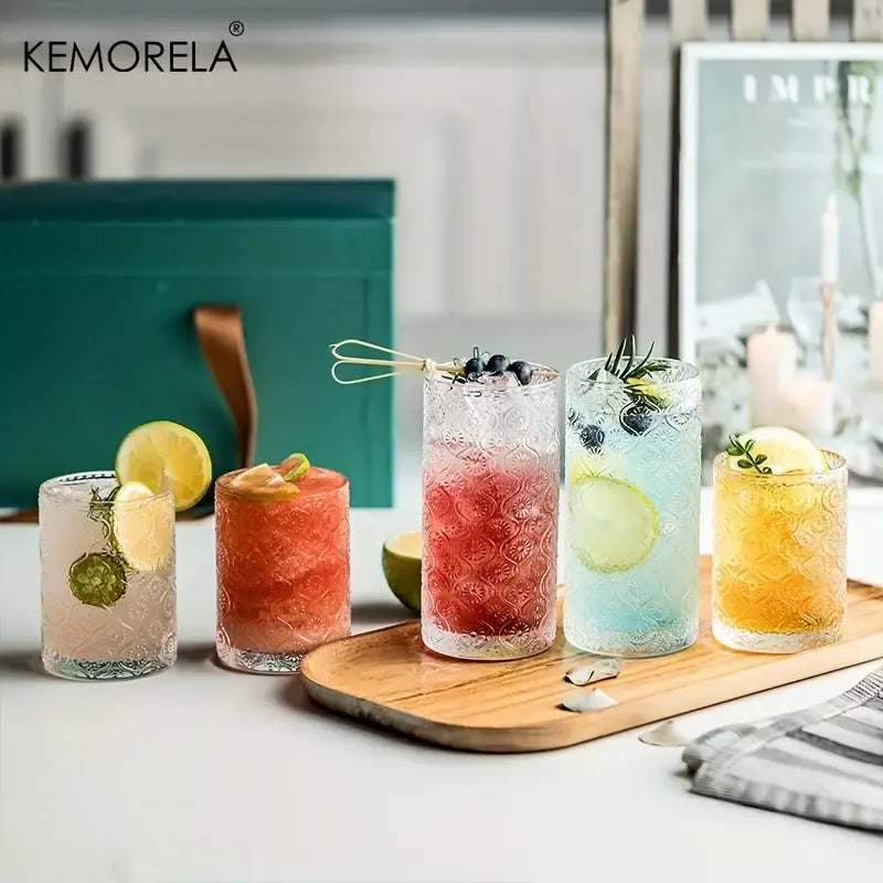 Set of four vintage glassware textured tumblers in blue red and gold with unique embossed patterns for dining use