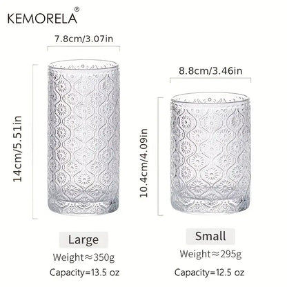 Clear glass tumblers with intricate embossed floral patterns in large and small sizes vintage glassware set