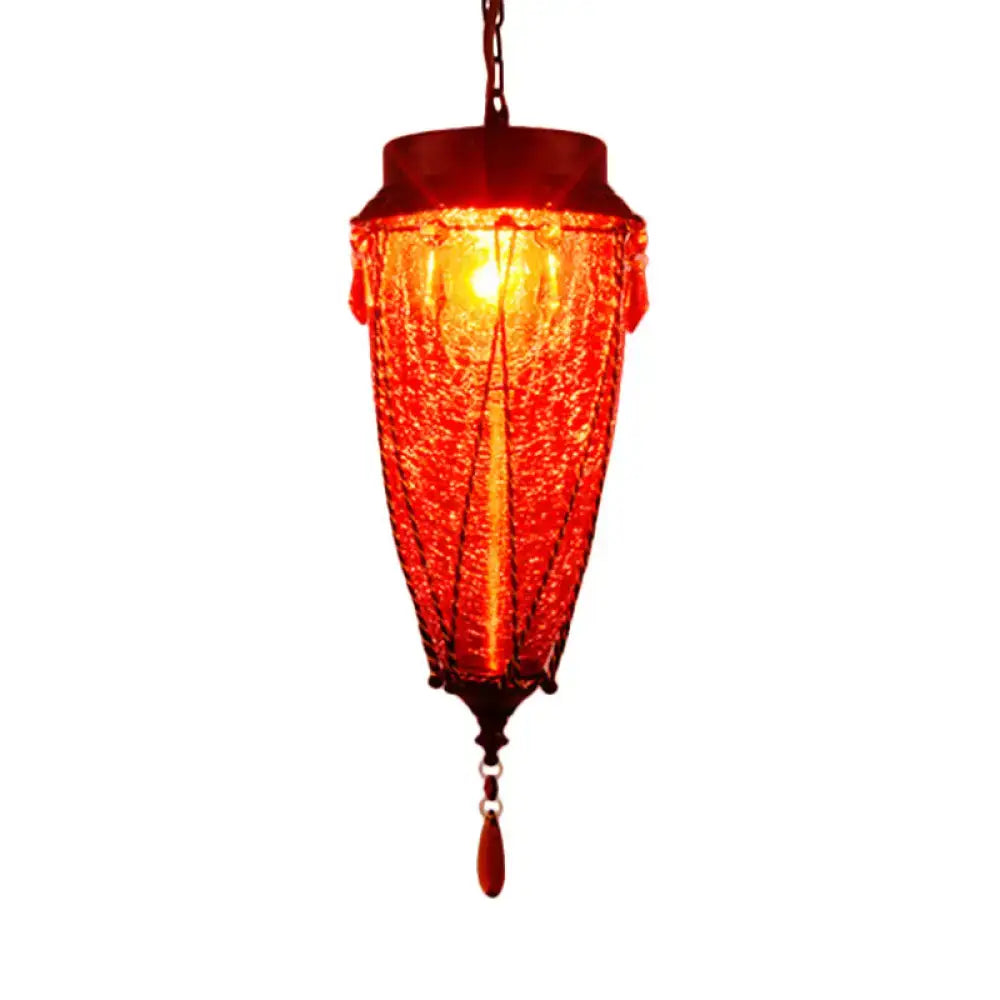 Vibrant red textured glass pendant light with dark metal frame and hanging teardrop pendant for vintage style lighting