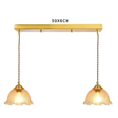 Gold-toned pendant light with two hanging amber cracked glass shades for vintage floral living room decorbites cracked glass