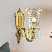 Gold-toned vintage floral wall light with crystal glass shade and dangling prisms for elegant wall lamp decor