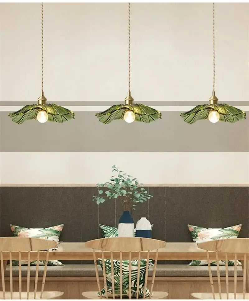 Three green leaf-shaped glass pendant lights with brass fixtures vintage flower glass pendant light dining room trio