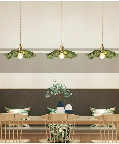 Three green leaf-shaped glass pendant lights with brass fixtures vintage flower glass pendant light dining room trio