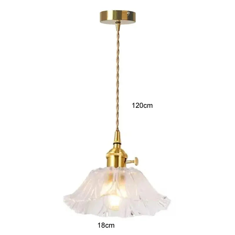 Vintage flower glass pendant light featuring a delicate white translucent glass pendant light with brass fixture