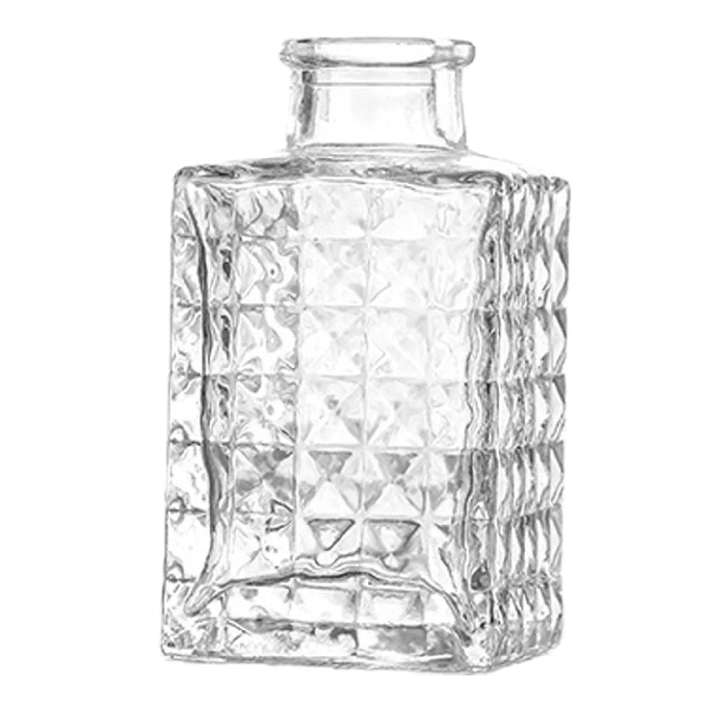 Clear glass vase with faceted geometric pattern and short neck used as vintage French pot decor and plant pot decor