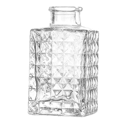 Clear glass vase with faceted geometric pattern and short neck used as vintage French pot decor and plant pot decor