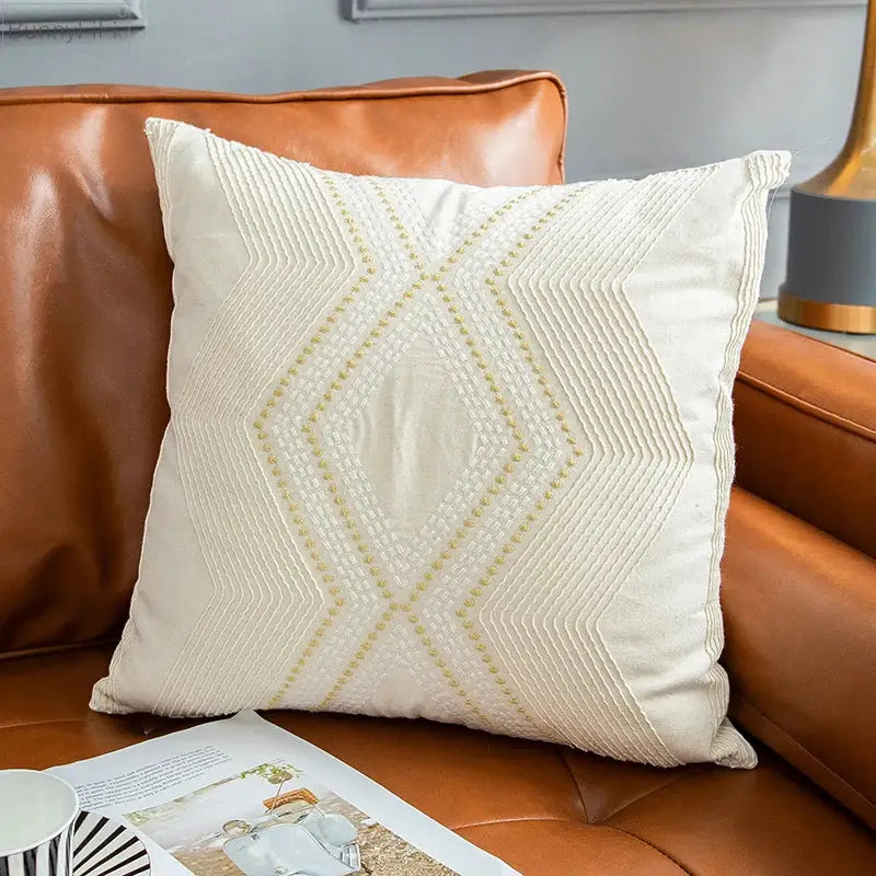 Cream-colored cushion cover with intricate soft gold geometric ivory vintage embroidery for living room decorbites