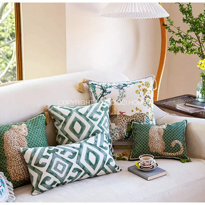 Green and white geometric patterned bolster pillow case with tassels for vintage bedroom decor