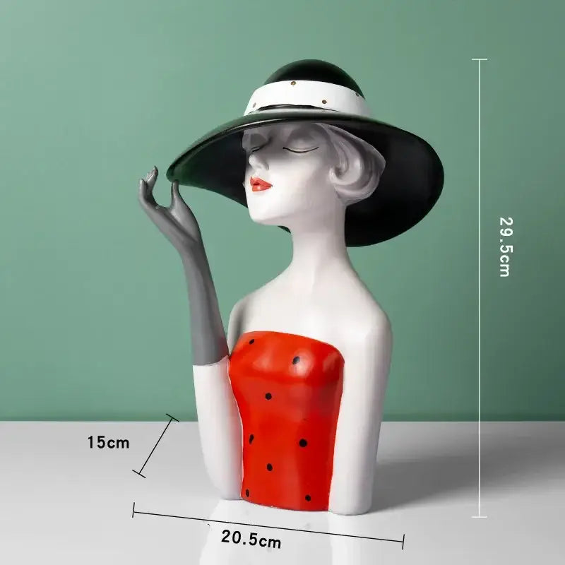 A stylish vintage glamour resin bust in red and white with black hat and gray gloves perfect for decorbites elegant living room decor