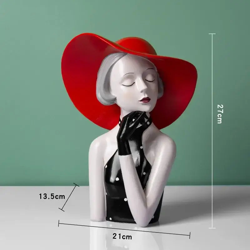 A glossy ceramic vintage glamour resin bust of a woman in a red hat and polka-dot dress for decorbites elegant living room