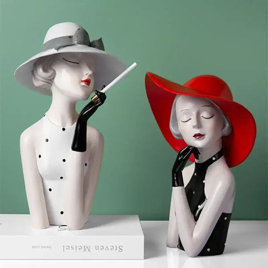 Two glossy resin vintage glamour busts featuring red and white hats with black gloves for decorbites elegant living room decorbites elegant high-level