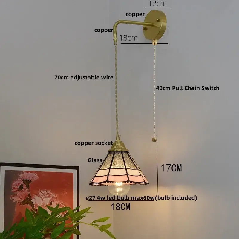 Vintage glass brass led wall sconce with pull chain featuring a pink and amber stained glass shade by decorbites wall sconce