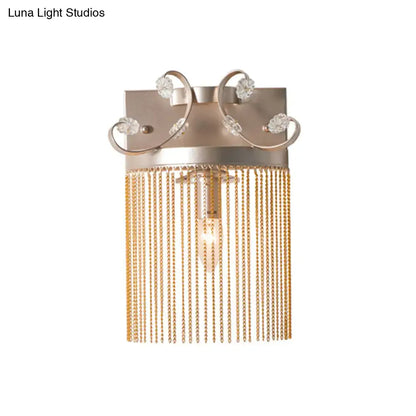 Vintage gold aluminum tassel wall light with rectangular backplate crystal accents and cascading gold chains wall light fixture