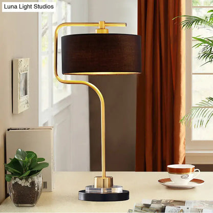 A decorbites vintage black table lamp with gold finish, drum shade, and modern curved base for living room 220v-240v