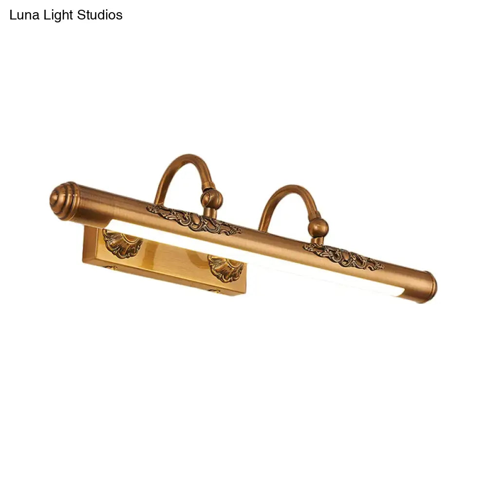 Antique brass-finished vintage gold carved floral vanity light bulb with ornate scrollwork and two curved hooks wall mounted