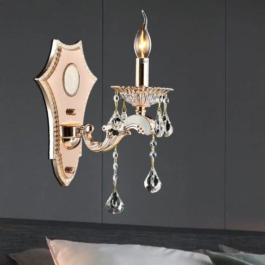 Vintage gold crystal sconce light fixture with teardrop pendants and shield-shaped backplate direct wired electric
