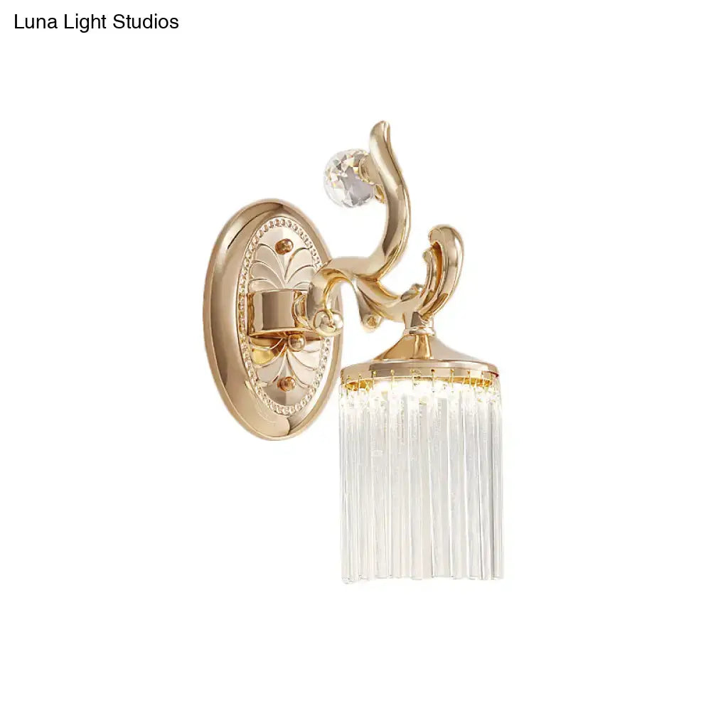 Vintage gold wall mounted light with decorative crystal accent and cascading clear pipe prisms for bedroom use