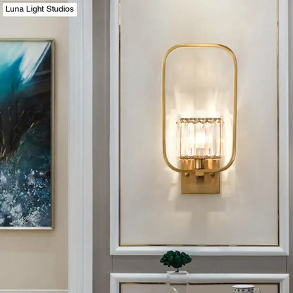 Vintage gold finish metal wall sconce with crystal shade featuring rectangular glass and vertical crystal accents