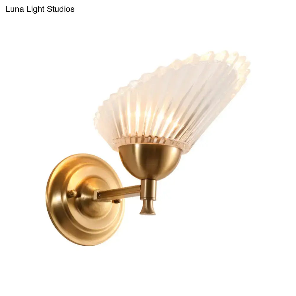 Vintage gold finish wall lamp with antique brass frame and frosted fluted glass shade for bedroom use