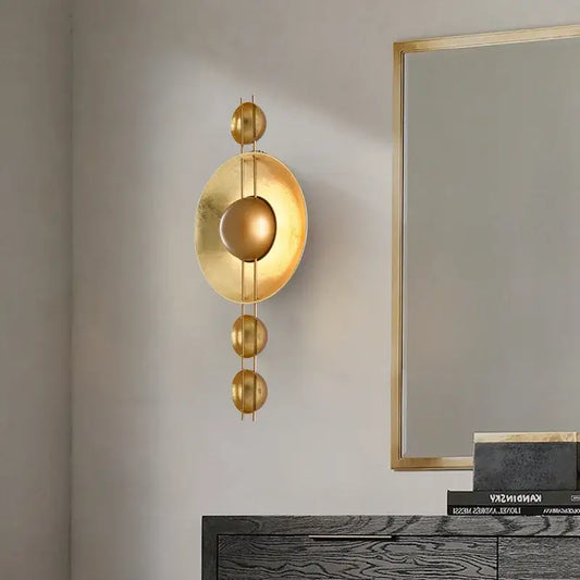 Vintage gold led geometric wall lamp with concentric circular and spherical elements for luxe bedroom decorbites gold led decor