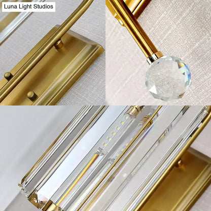 Vintage gold wall light with clear crystal shade featuring gold finish and sleek modern design for bedroom sconce