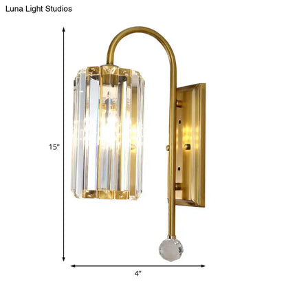 Vintage gold wall light with a clear crystal shade featuring vertical prisms and a faceted glass globe base for bedroom use