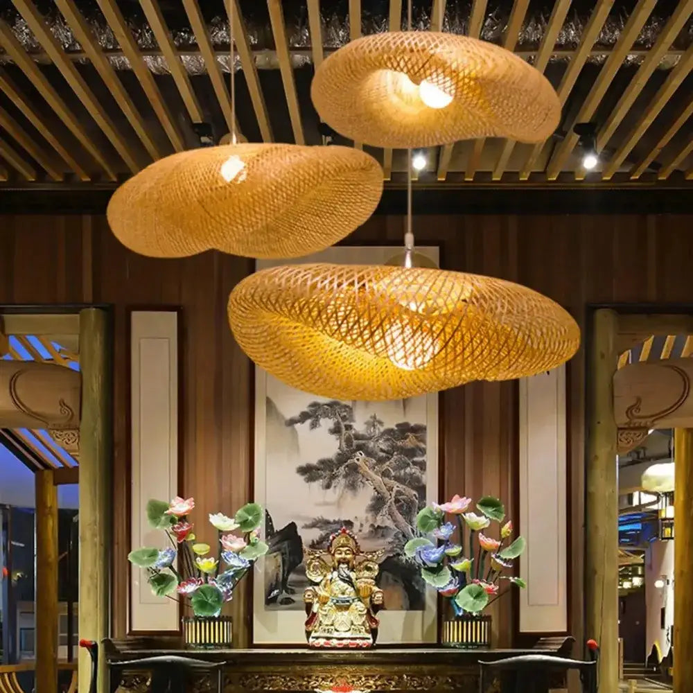 Three woven bamboo led pendant lights with warm golden illumination for dining room or living room use
